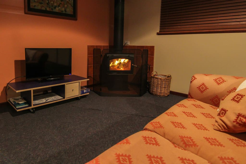 The lounge is a comfortable space year round and is equipped with a cosy wood fire for the cooler months.