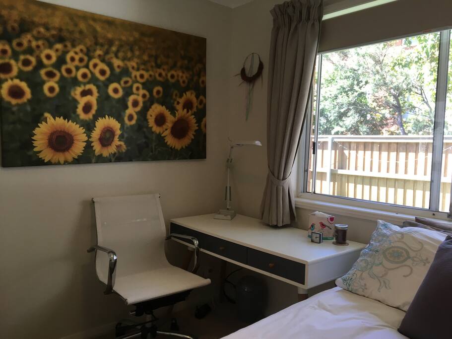 Bedroom with queen bed, desk, chair