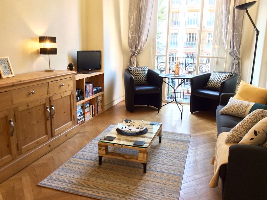 Living room wth entertainment area. Flat screen TV, Hi Fi & varied DVD & book selection.