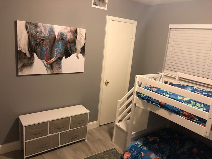 Bunk beds with stairs that allow for safe & easy access for kids. Top bunk holds up to 150 lbs. Closet space.