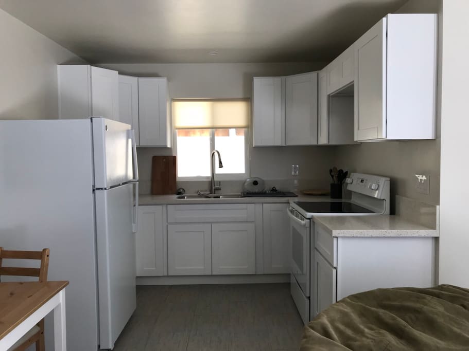 Full kitchen- refrigerator, stove , oven, microwave, sink. Dishes for 4 and cooking utensils.