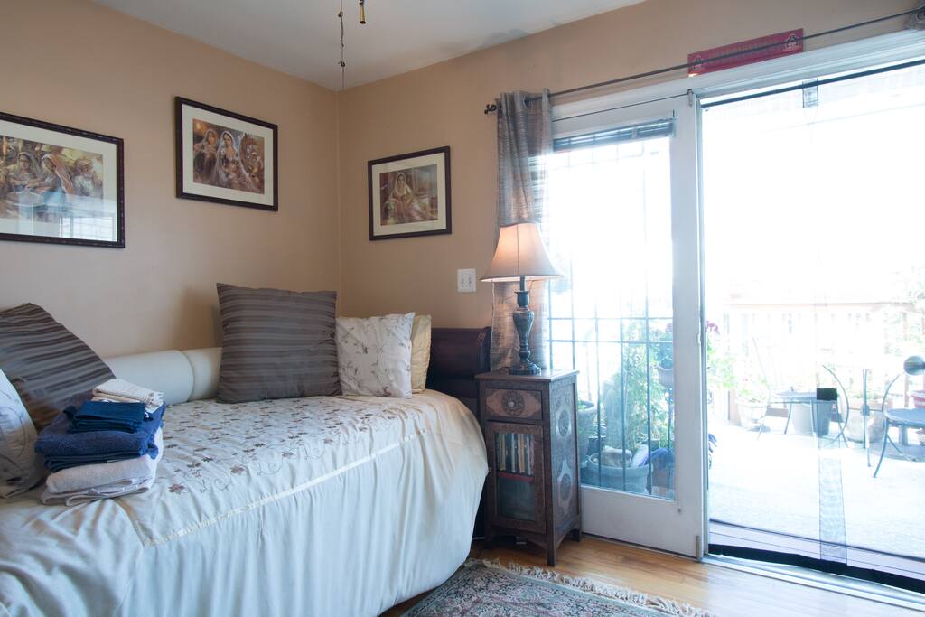 Bedroom with a day bed and a trundle. Access to the small deck off the room.