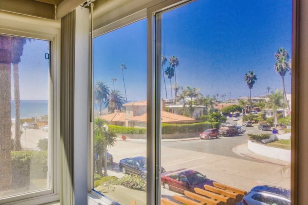 View out living room window to beach, just 6 houses away