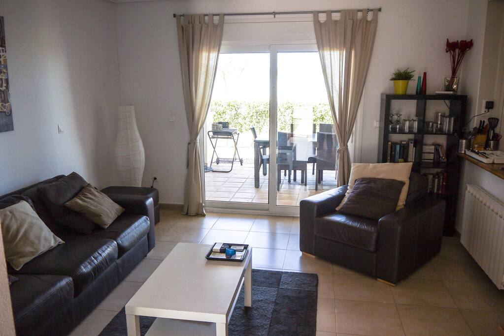 Open plan lounge with leather sofa and chair, full Sky package and air conditioning