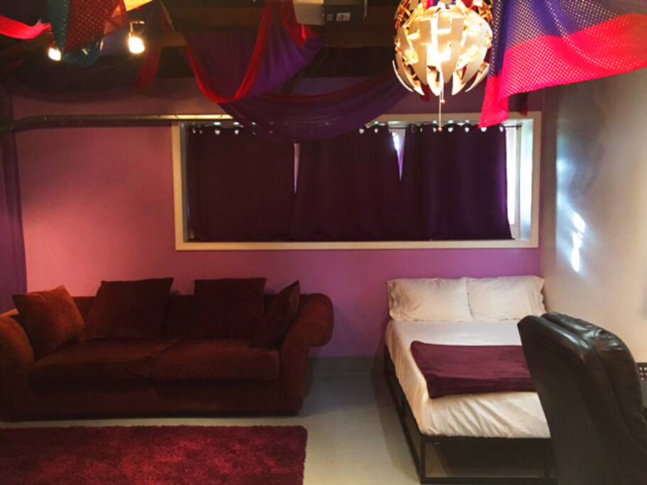 Cozy couch to relax on and comfortable bed