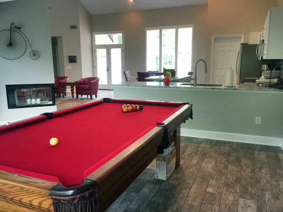 Enjoy watching the family play a game of pool while fixing dinner.