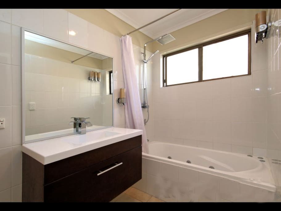 New 10 jet Spa Bath plus stylish vanity to enhance the family bathroom