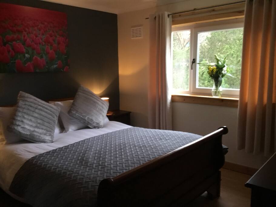 King size bedroom, large 3 door wardrobe and walk in shelved storage area, bedside cabinets, chest of drawers and 32inch wall mounted telly with free-sat.