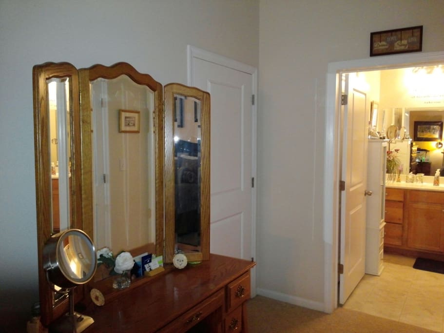Vanity and en suite bathroom entrance.
