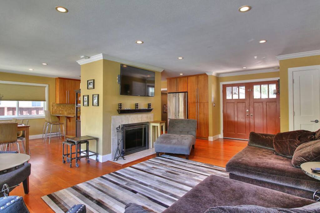 Open living room with wood fireplace