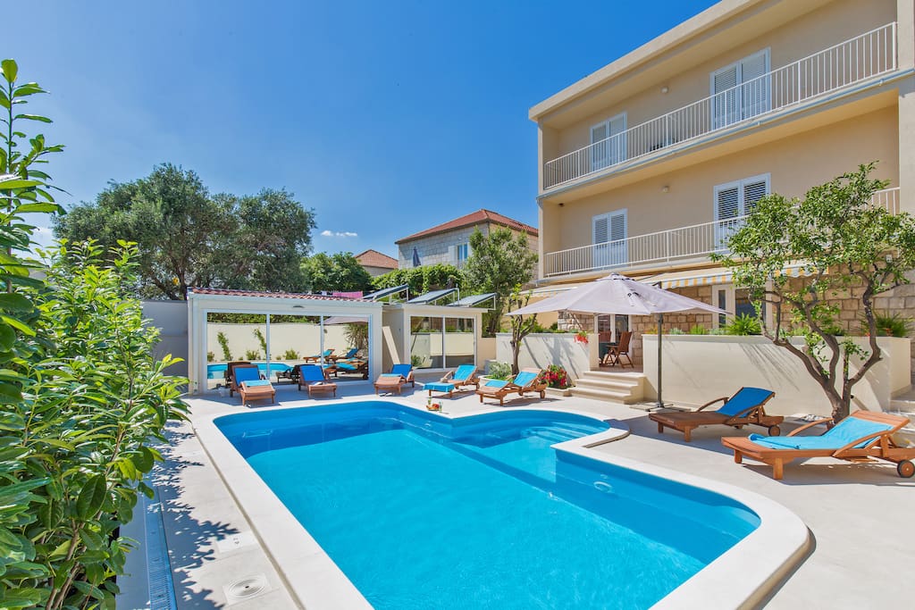 Spacious shared Pool in front of the apartment, chairs to relax and enjoy perfect weather and Your stay at St. Thomas Apartments
