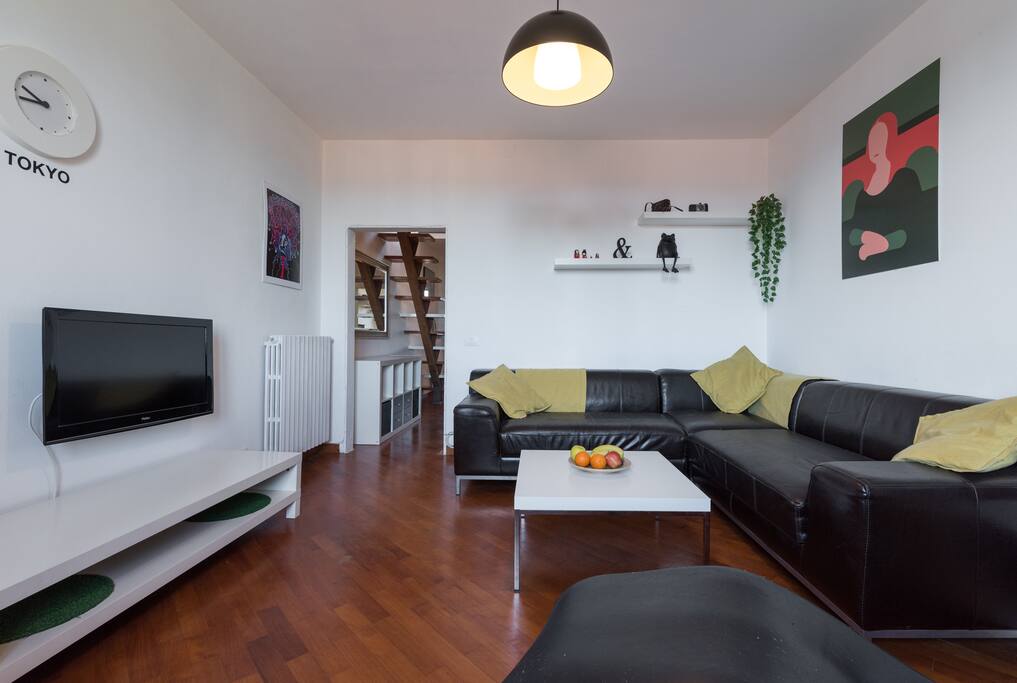 Bright living room room with large corner sofa