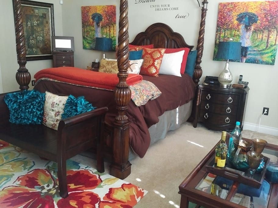 The Master bedroom has a queen bed with a TV and a work space.