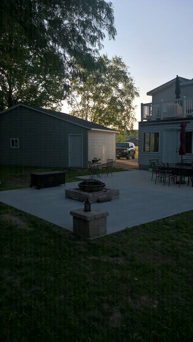 Back patio sits 8 with grill and beautiful fire pit