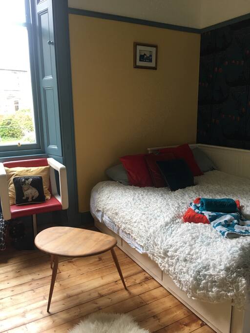 Large comfy double bed in beautiful room with space to sit.