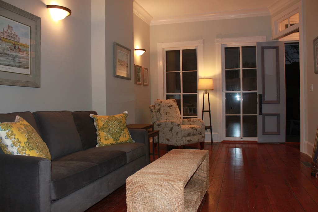 You enter this home into The Parlor Room with sofa, recliner and TV.