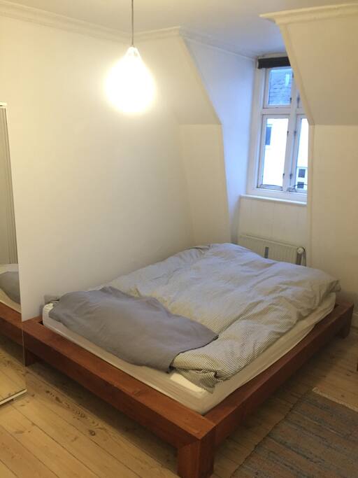 Minimalistic, queen size bed.