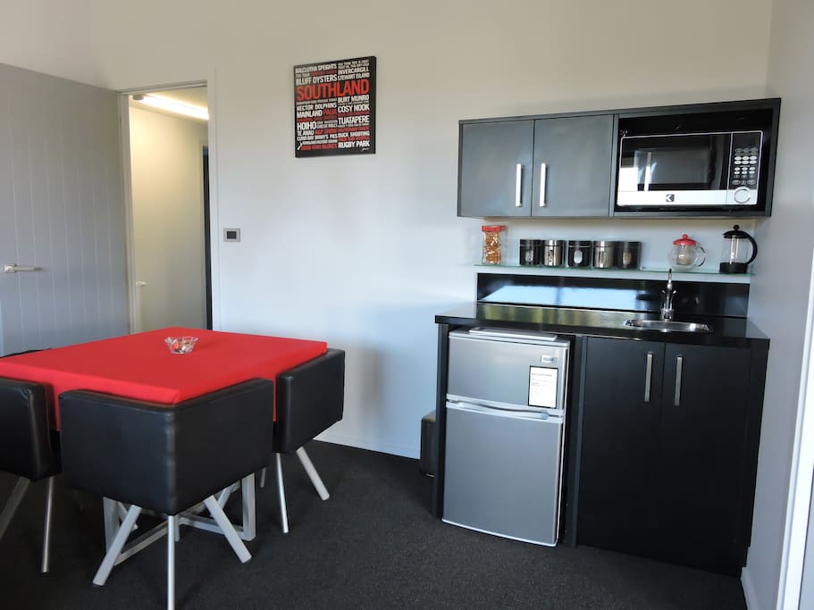 Shared lounge/dining area with complimentary tea/coffee and bar fridge