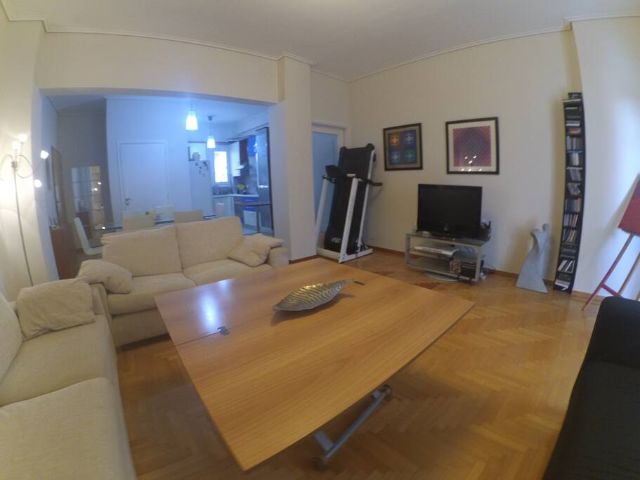 Living room with 3 big sofa and a big table