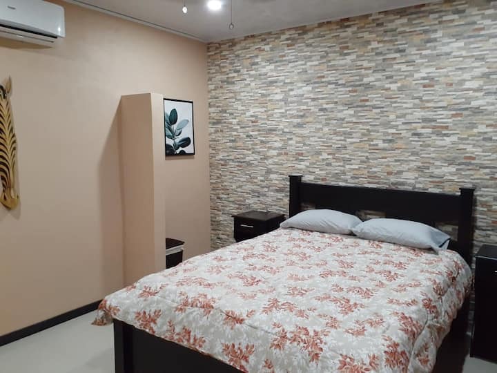 Master Suite #3 with AC, Private Bathroom, and TV. 