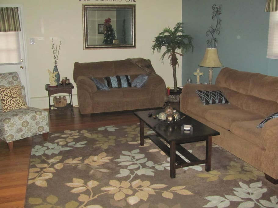 Common area with 55 Inch flat screen TV, mini fridge, pub table with two chairs. 22x15