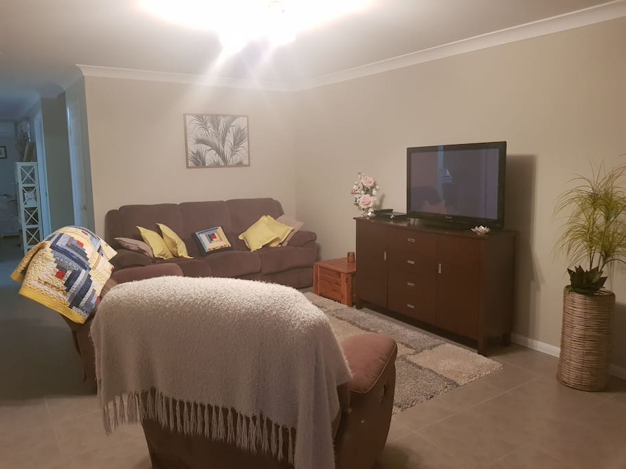 Cute lounge room with TV, DVD and Google Chrome Link.