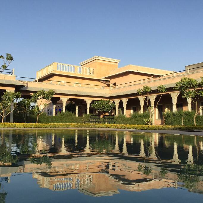 The main swimming pool with the cottage behind