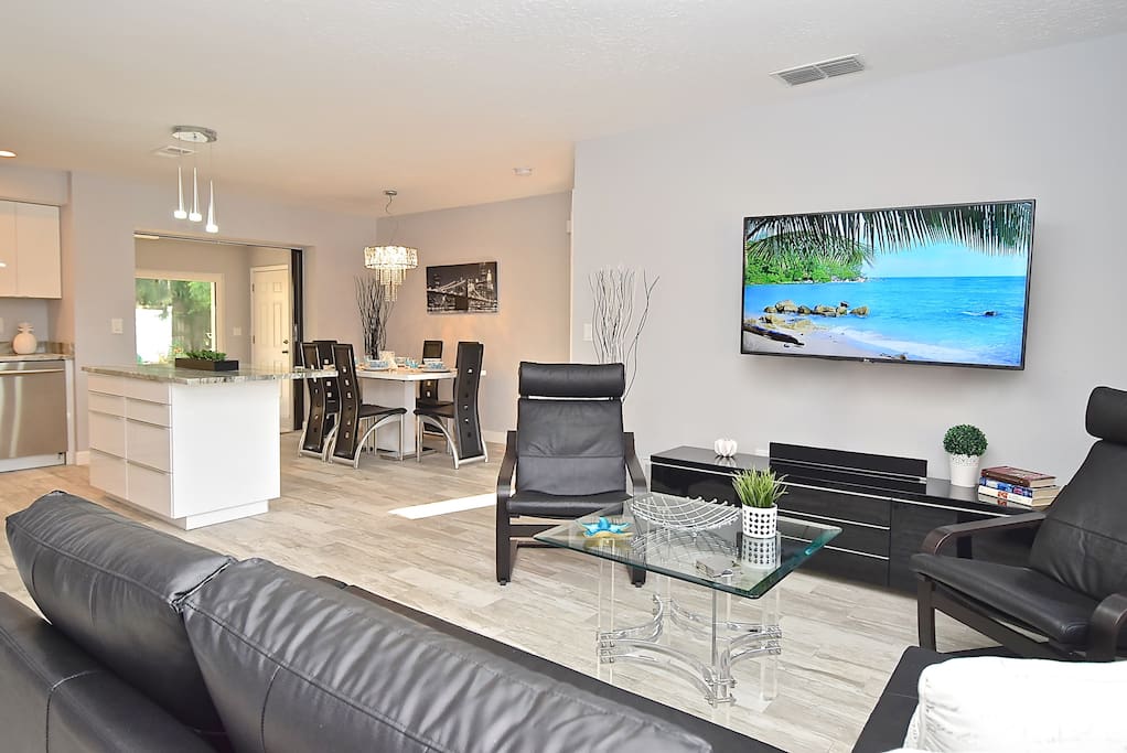 Open floor-plan of the living room opens to the dinning area and kitchen