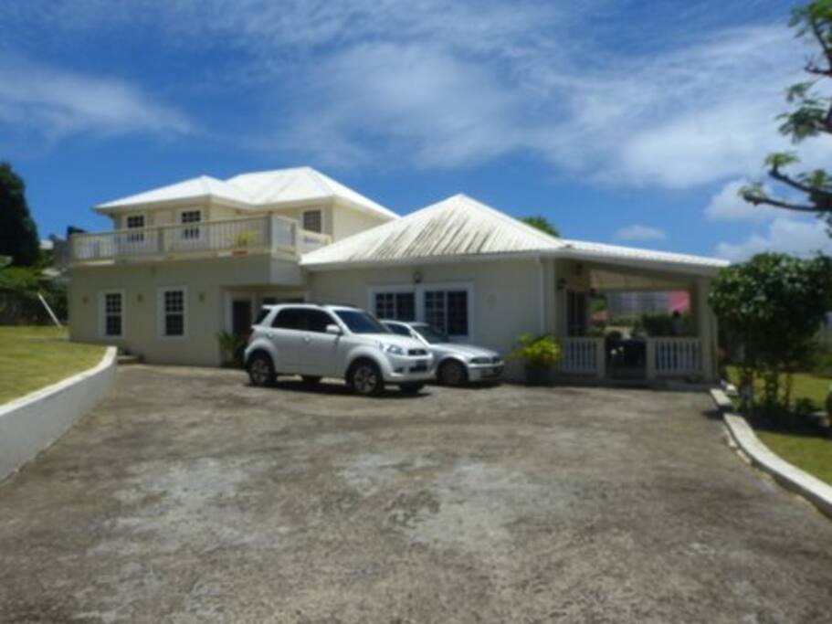 Main entrance with ample parking space and secure gated enclosure