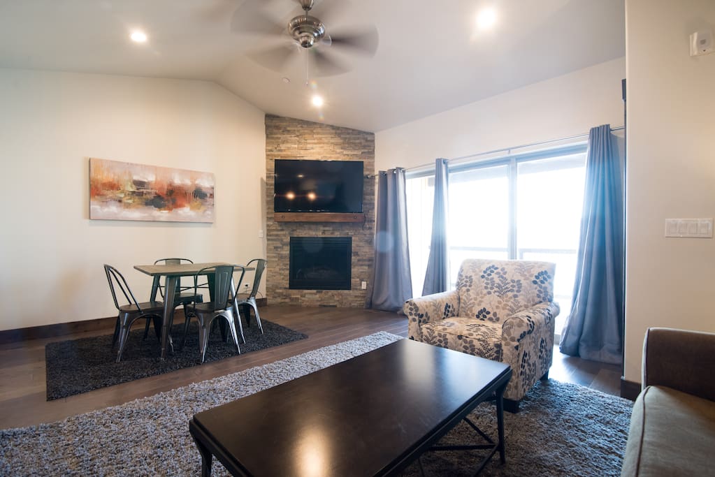 Family room with view of TV and access to balcony that views of Deer Valley Ski Resort