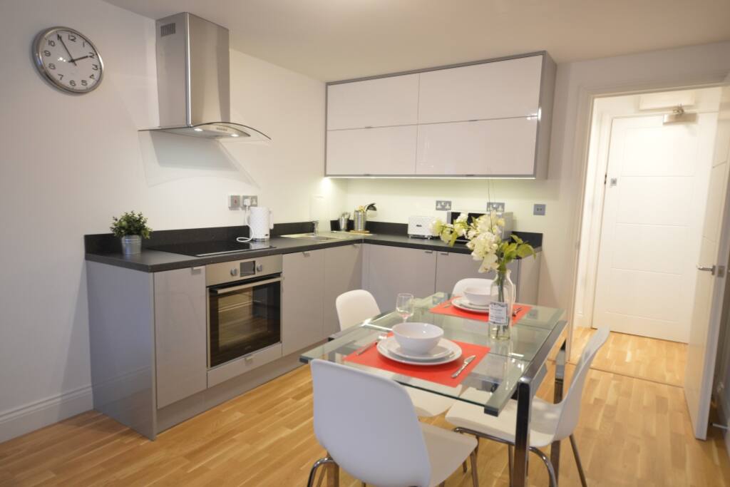 Dining/kitchen area with washer/dryer and dishwasher