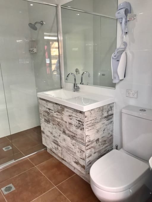 Shared Guest Bathroom complete with shower, toilet, basin and hairdryer. Towels included :-)