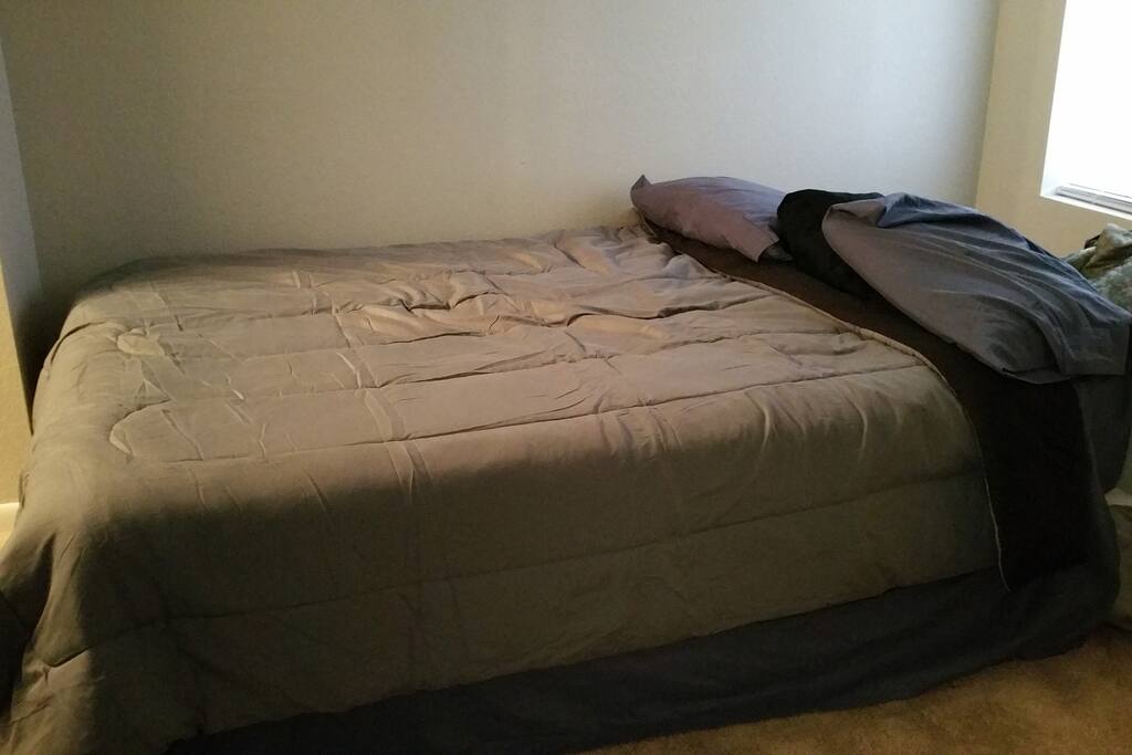 Queen bed with memory foam mattress topper