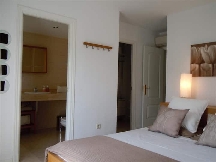 Main bedroom with private bathroom and wardrobes