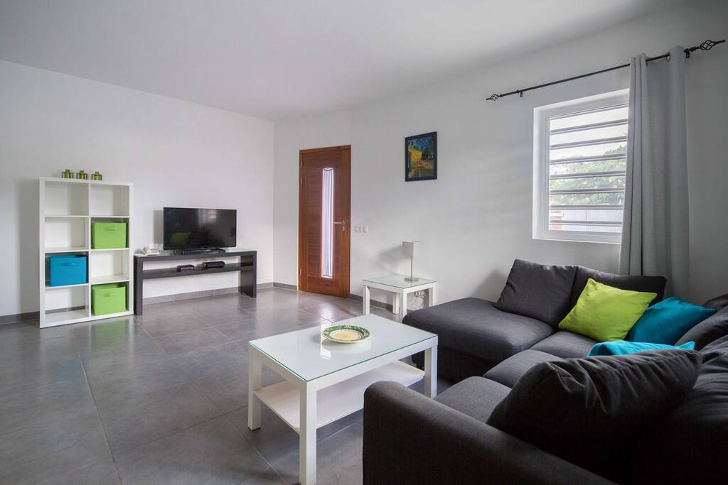 Comfortable
L-shaped sofa and flat screen TV