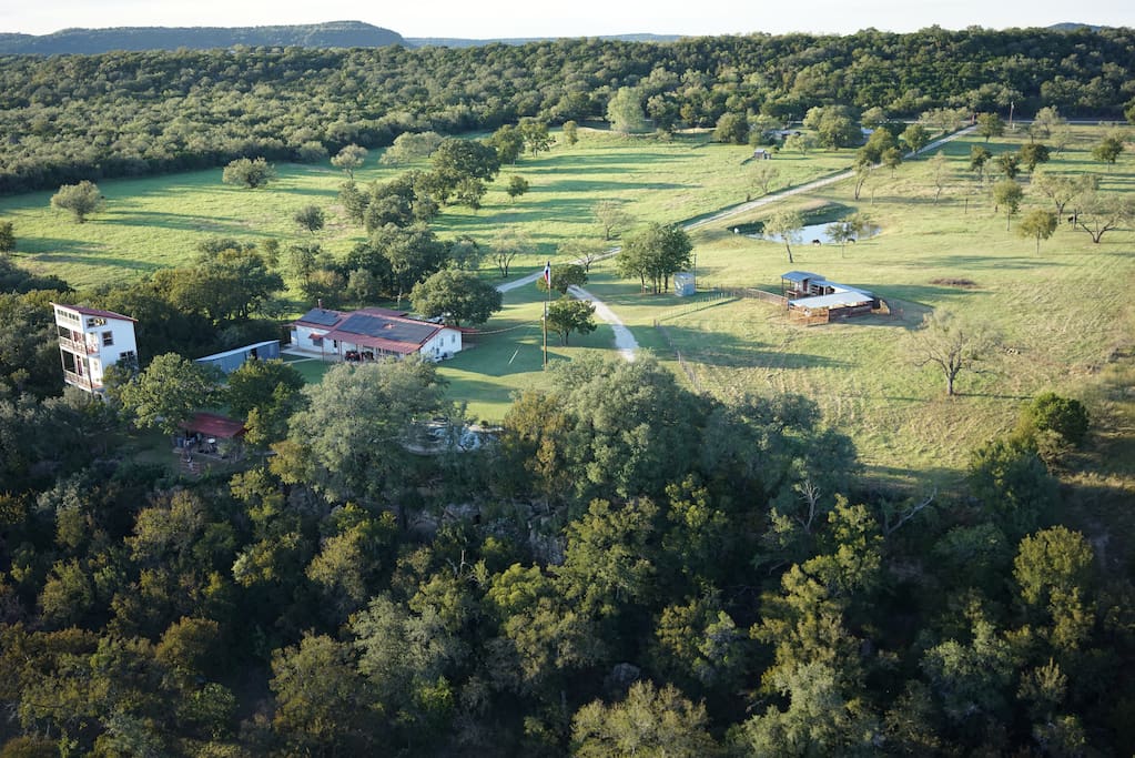 Aerial view of the main house, lookout (not for rent) and surrounding pastures.