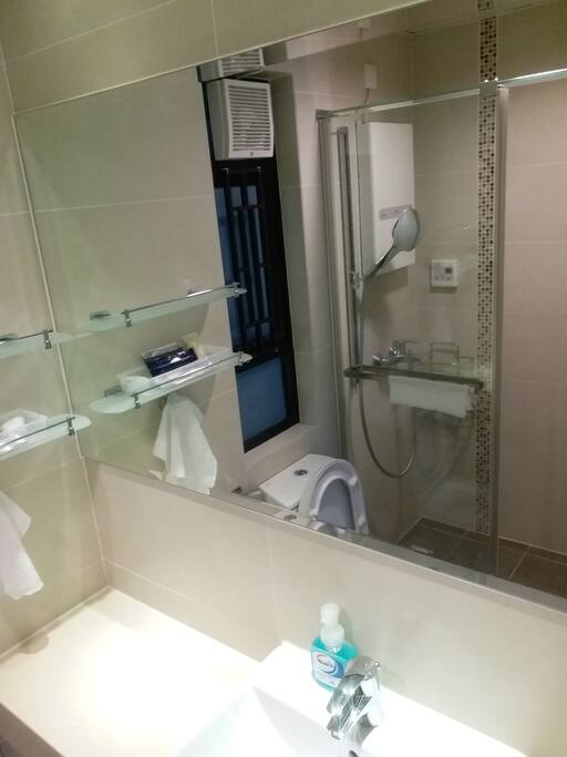 Standing shower and ample vanity counter space