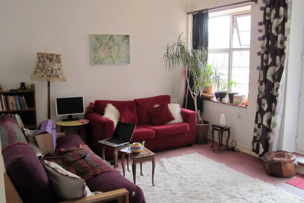 Sitting room with 2 sofas (one is a sofa bed, comfy and good if 2 friends sharing) Double doors to balcony