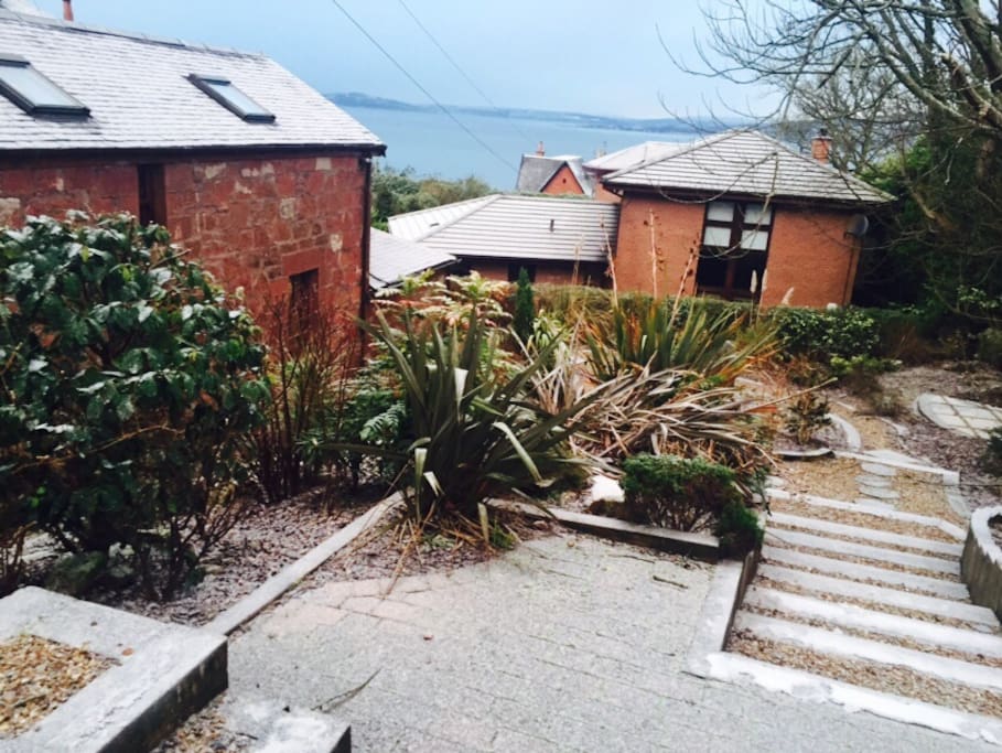 Our garden with coachhouse on the left