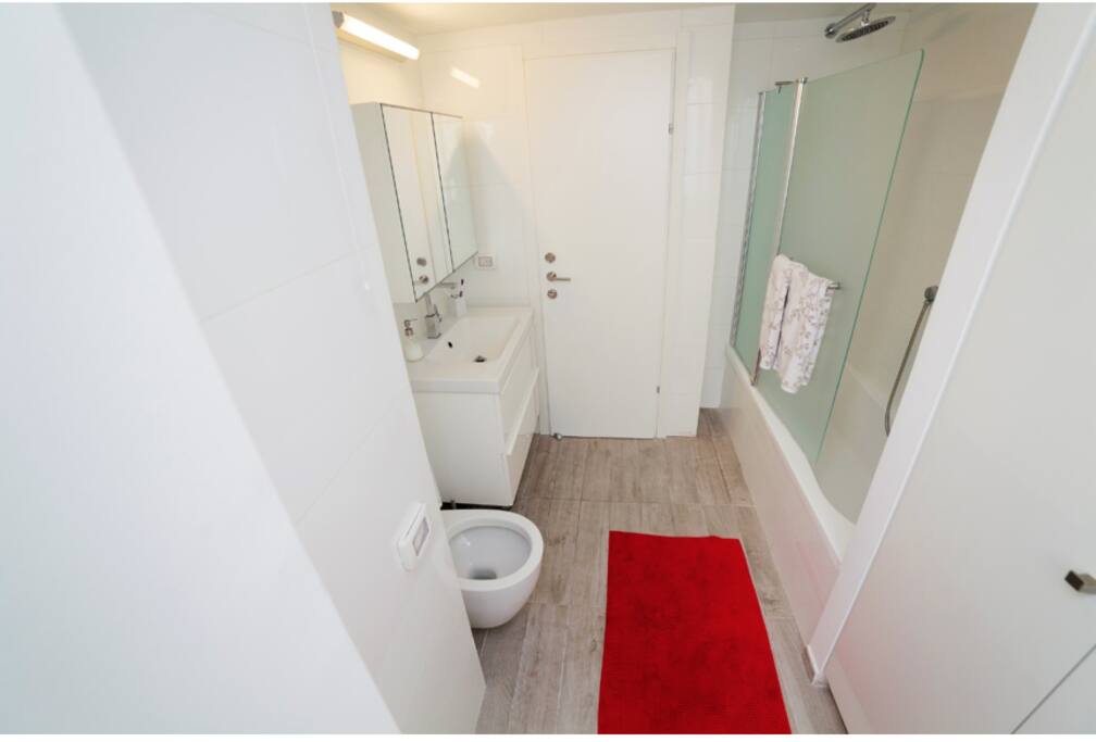 Modern bathroom with washer and dryer