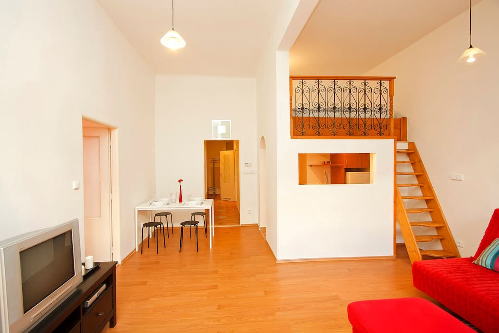main living room with mezzanine level bed