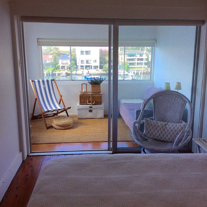 Private glass enclosed sunroom off bedroom.