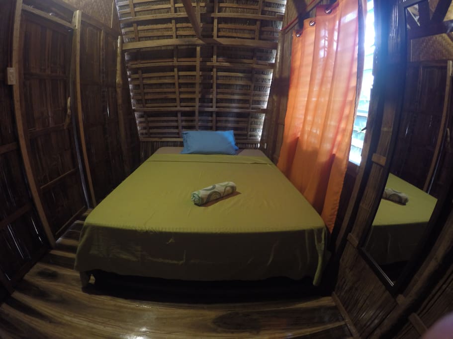 Room with mosquito net and stand van
