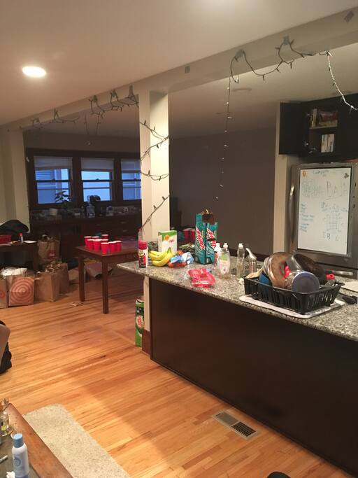 From the living room: view of the kitchen and walkway to the bedroom.