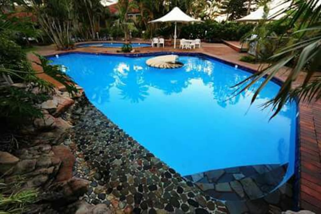 Two gorgeous pools where little baby Eastern Australian water dragon lizards roam. There is a relaxing water feature to sit under. Great for kids or private couple moments until 9pm