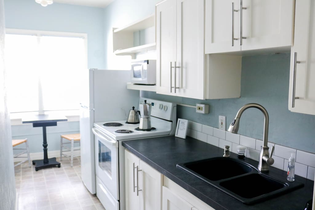 Sparkling clean, the kitchen provides the perfect spot to make a delicious meal.