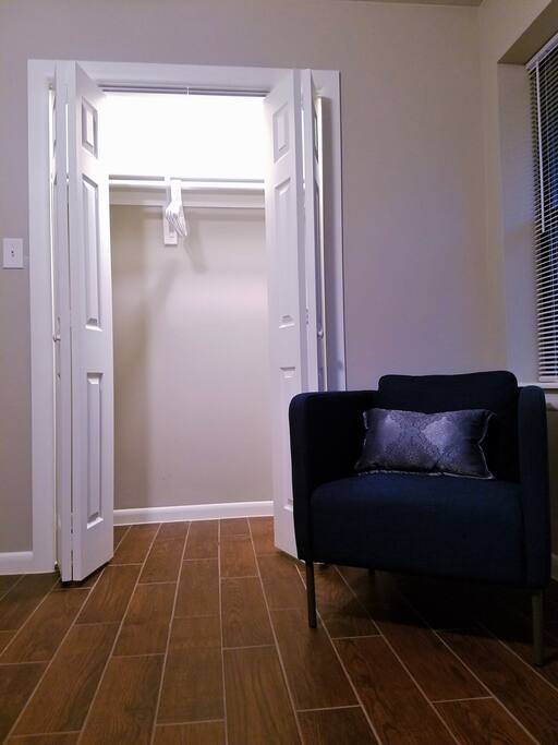 Comfy reading chair that is perfect for cozying up in. Big closet as well!