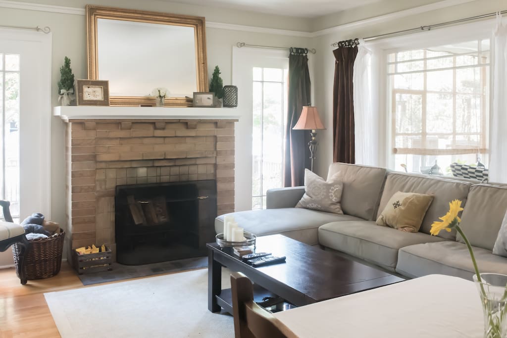 Spacious private living room space with a comfy, easy pull out queen sized couch for extra guests- for 2! Original 1920 windows, molding, lighting and flooring at this Old World Charm.