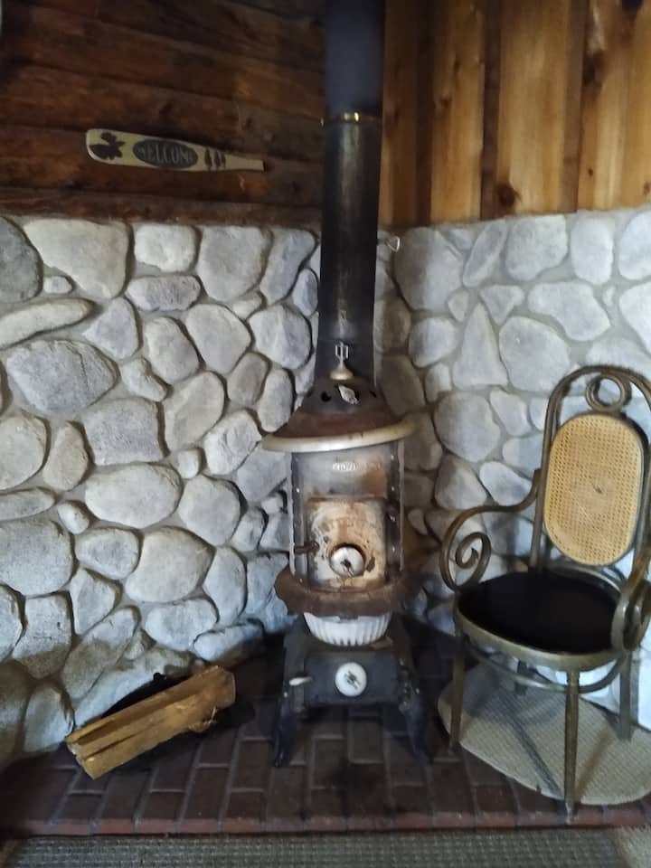 Potbelly stove in the living room makes the cabin nice and warm in the winter. 