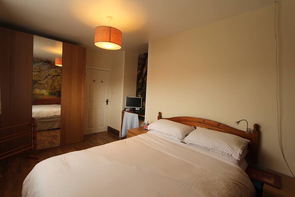 Double bed, space to store your things on the floor, clothes hanger for your use, hooks on back of the door for your use